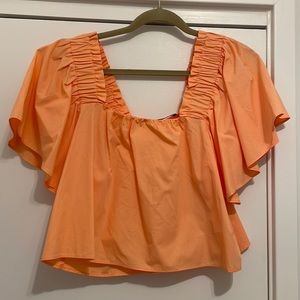 ZARA - Women’s orange off the shoulder top.